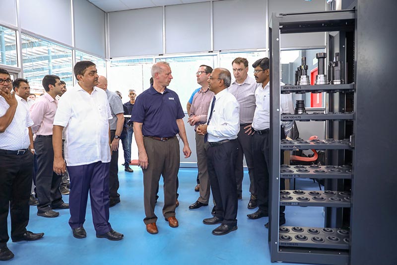 Participants in the tool-setting area. On the right you can see the tool dispensing system.