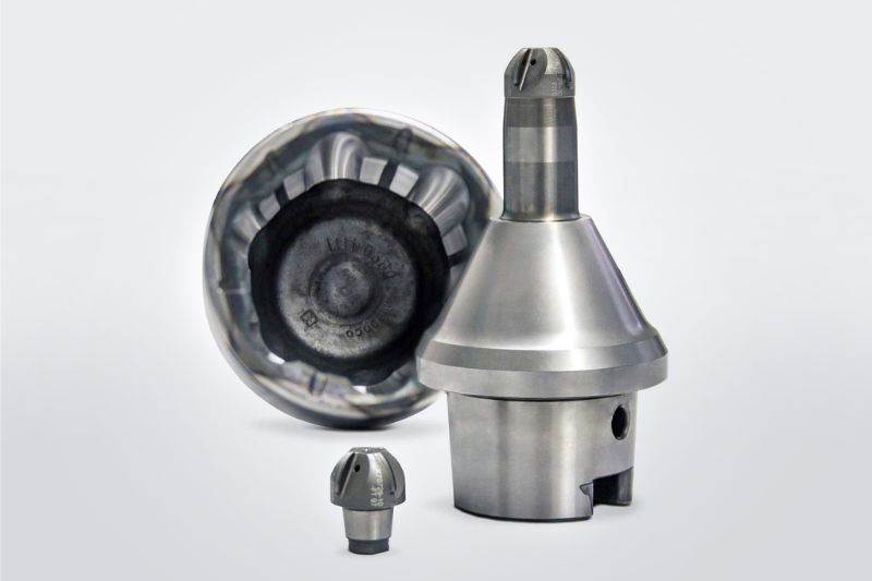 One ball cutter head and one ball nose milling cutter with tool holder and connection. The spherical shell is in the background.